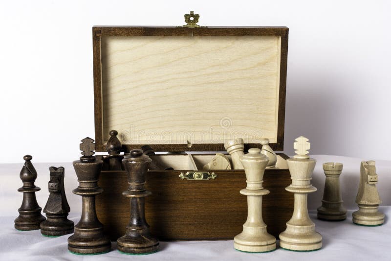 Carved Wood Chess Pieces on white background