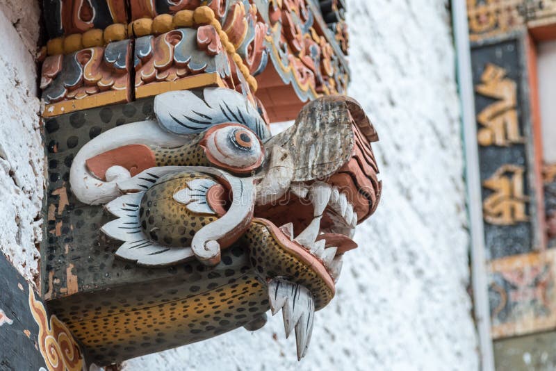 Dragon head decoration inside Buddhist monastery / fort Dzong in Punhaka, Bhutan stock image