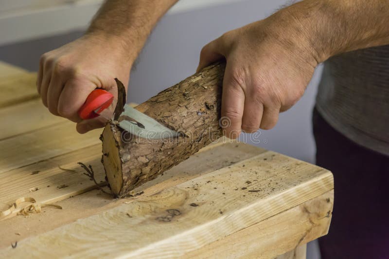 Carving a Piece of Wood with a Sharp Knife Stock Photo Image of hobby