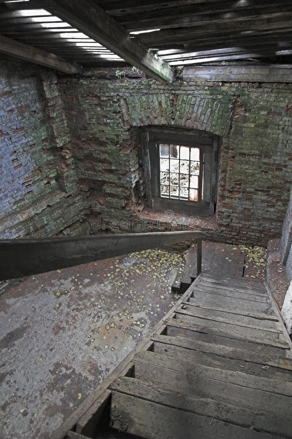 Abandoned store house hall with a staircase. Abandoned store house hall with a staircase.