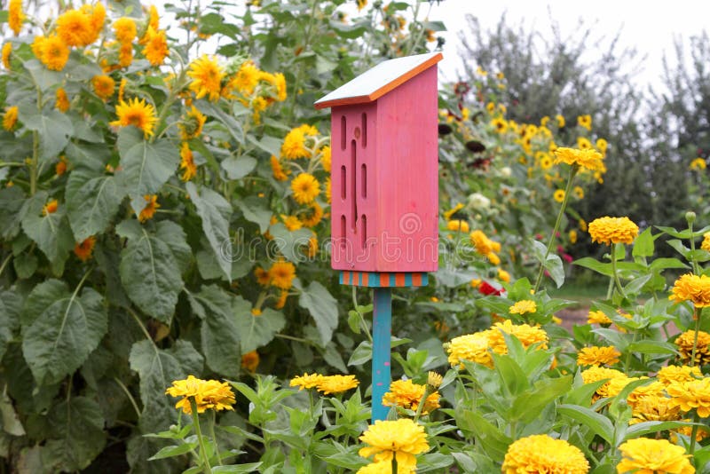 Cute butterfly house in ornamental garden in summer. Cute butterfly house in ornamental garden in summer