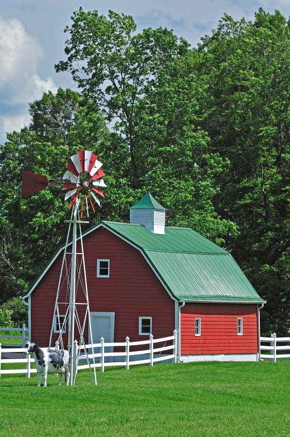 Farm house with windmill over the mature trees background. Farm house with windmill over the mature trees background