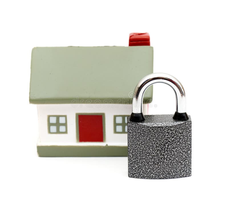 Miniature house with lock isolated on white. Miniature house with lock isolated on white