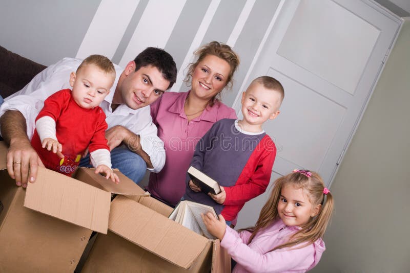 Young couple with children moving house. Young couple with children moving house