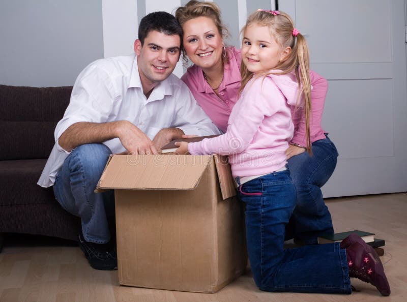 Young family moving house, real estate concept. Young family moving house, real estate concept