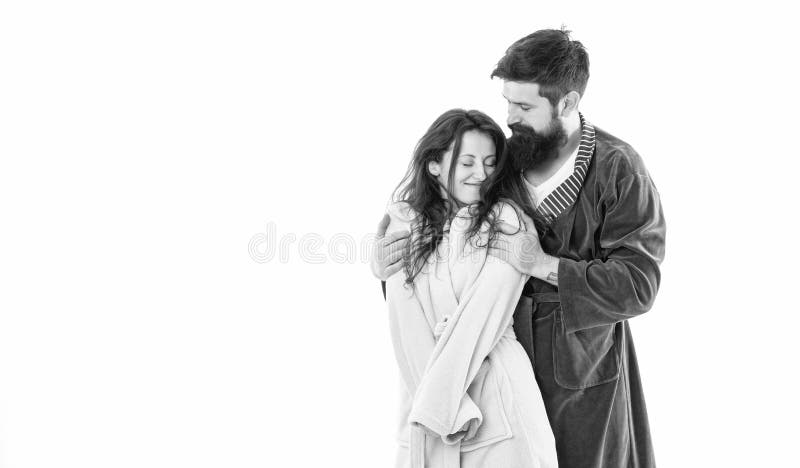 Happy family couple in robes of romantic man hugging sleepy woman in morning copy space, love. Happy family couple in robes of romantic man hugging sleepy woman in morning copy space, love.