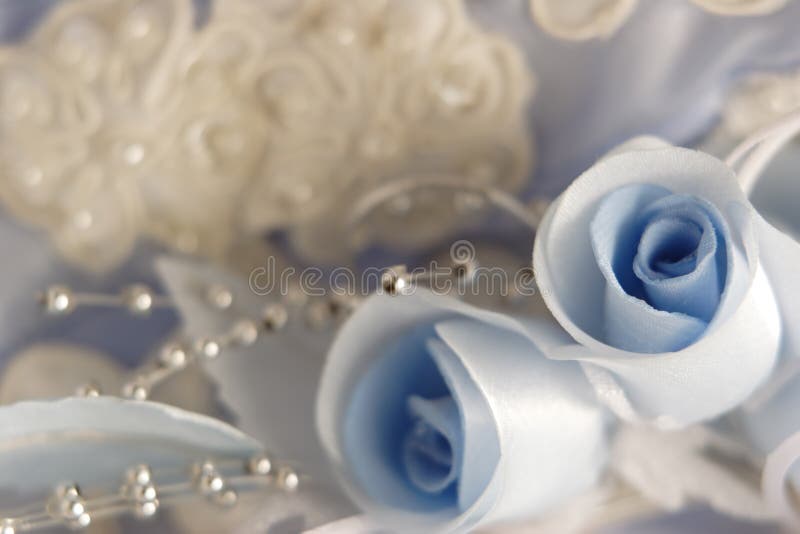 Blue roses and laces on a wedding gown. Blue roses and laces on a wedding gown