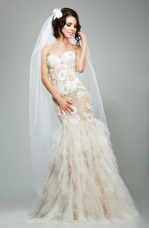 Happy Young Woman Wearing Sleeveless Wedding Dress. Happy Young Woman Wearing Sleeveless Wedding Dress