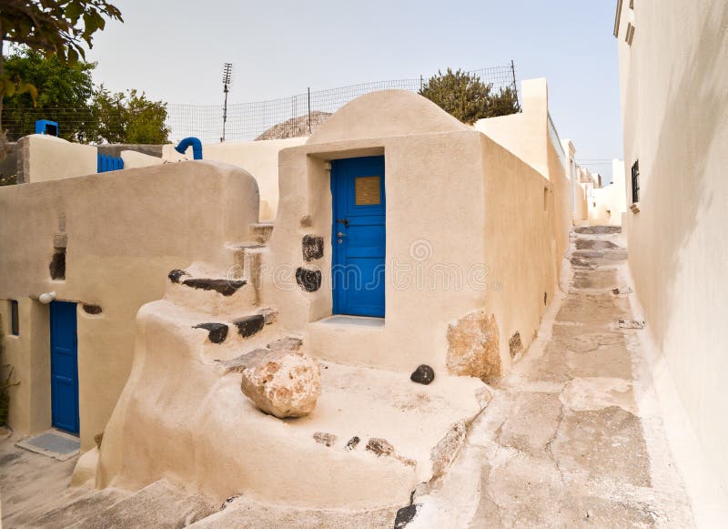 Emporio houses with deep blue doors and long street walls. Emporio houses with deep blue doors and long street walls