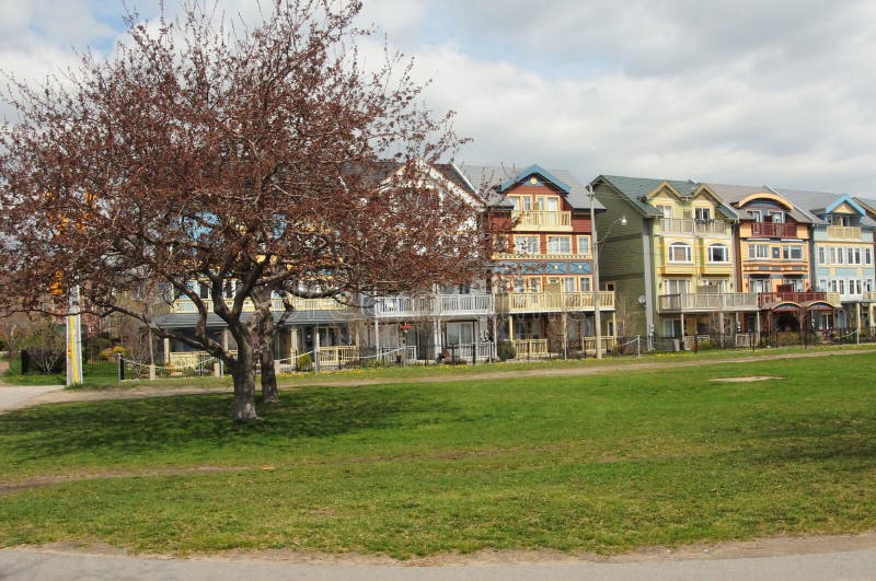 An image of residential row houses in a neighbourhood. An image of residential row houses in a neighbourhood.