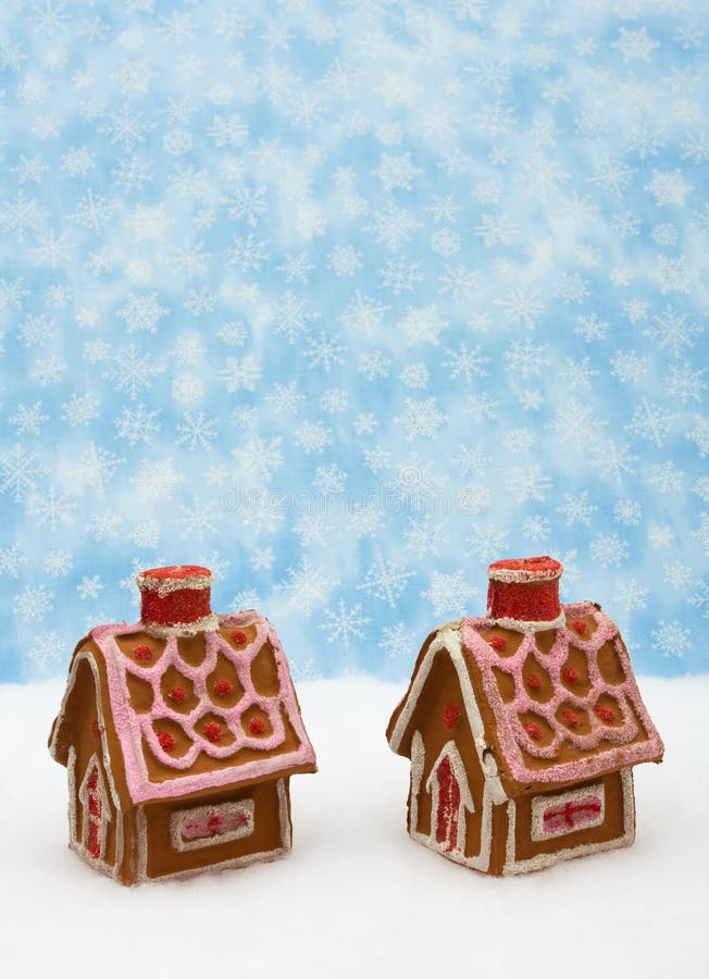 Gingerbread houses on snow with snowflake background, gingerbread house. Gingerbread houses on snow with snowflake background, gingerbread house