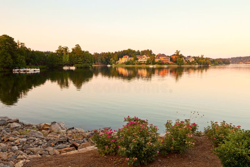 Luxury houses on a lake at sunset. Luxury houses on a lake at sunset