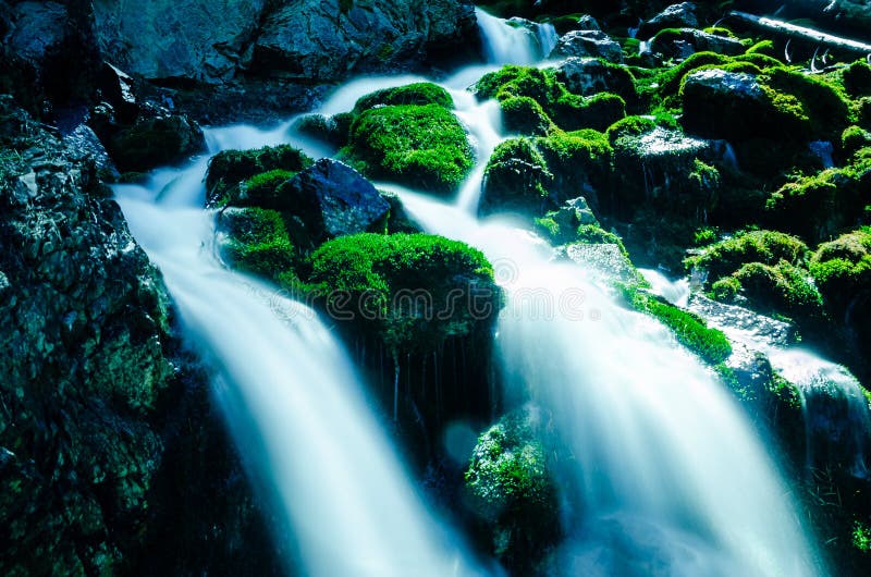 Water Falling Over Mossy Rocks royalty free stock photo Water Falling Over Mossy Rocks royalty free stock photo