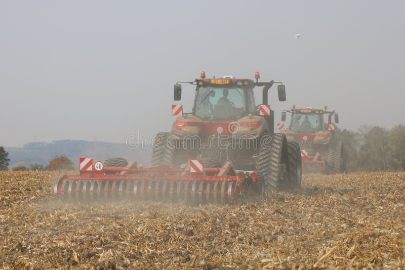 Tractors working on corn field in Czech Republic stock photos Tractors working on corn field in Czech Republic stock photos