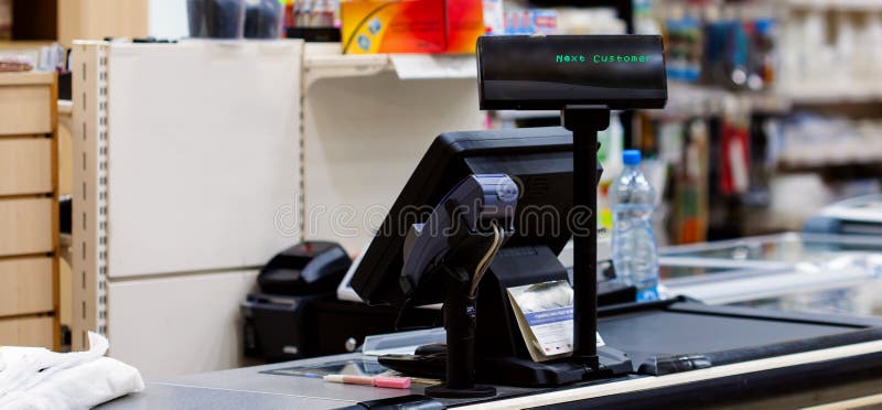 Cash desk with terminal in supermarket royalty free stock photos