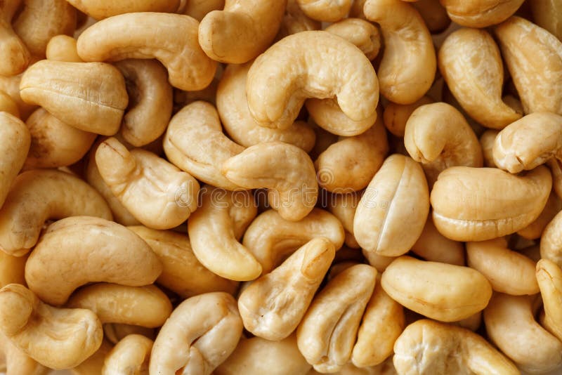 Cashew with no shell on a background. Macro nuts, Organic vegan food.