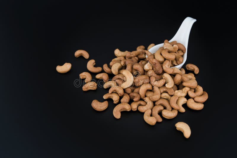 Cashew Nuts In A White Ceramic Spoon Isolated On Black Background. Healthy Food For Life. Stock Photo - Image of macro, nature: 121029300 Cashew Nuts In A White Ceramic Spoon Isolated On Black Background. Healthy Food For Life. Stock Photo - Image of macro, nature: 121029300