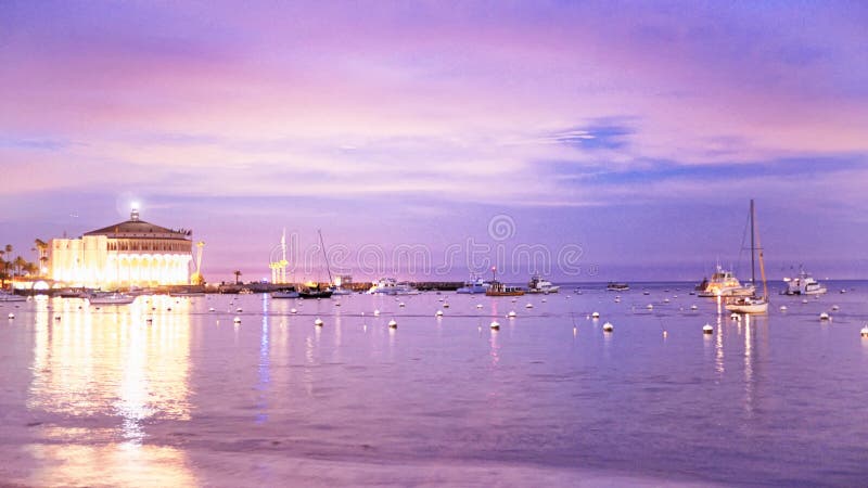 Casino at Catalina Island Offset with Ships in Bay at Sunset with purple skies. Casino at Catalina Island with ships in bay at sunset or sunrise with purple royalty free stock photography Casino at Catalina Island Offset with Ships in Bay at Sunset with purple skies. Casino at Catalina Island with ships in bay at sunset or sunrise with purple royalty free stock photography