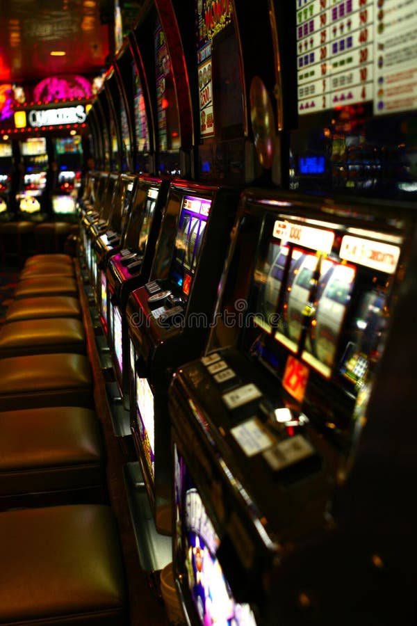 Casino slot machines with glowing screens. Casino slot machines with glowing screens.