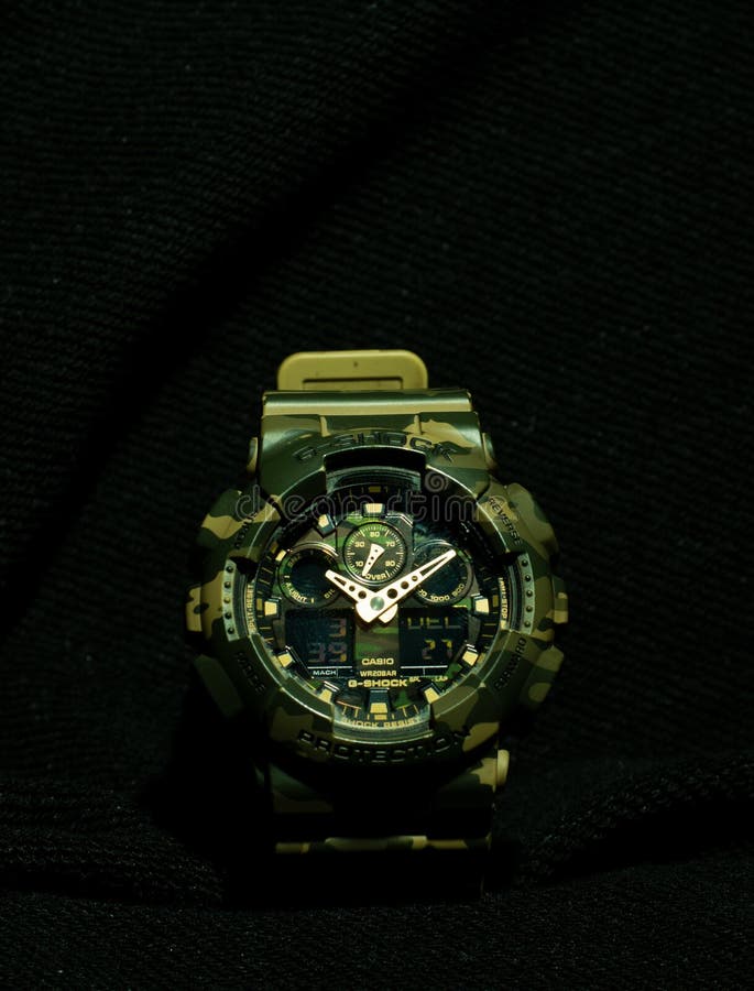 A close up of a waterproof Casio G Shock watch on a black background. A close up of a waterproof Casio G Shock watch on a black background.