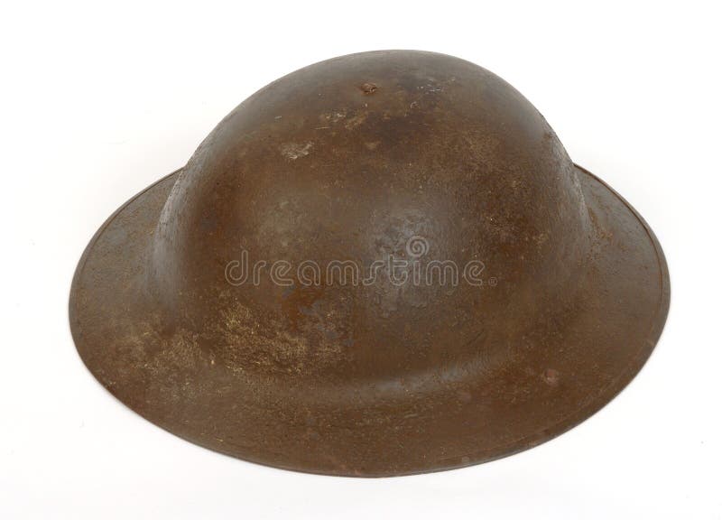 A WWI British Brodie Mk I helmet. The shell retains traces of the anti-glare sand paint. details. Used by British and commonwealth troops during trench warfare. A WWI British Brodie Mk I helmet. The shell retains traces of the anti-glare sand paint. details. Used by British and commonwealth troops during trench warfare