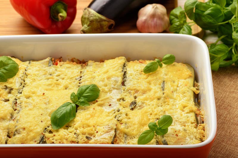 Casserole with Chicken, Eggplant, Zucchini and Tomatoes. Stock Photo