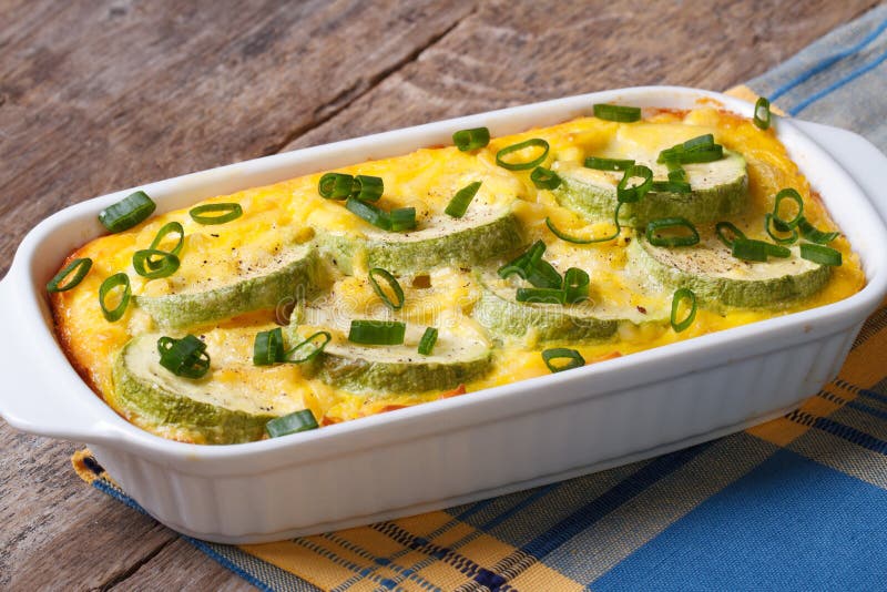 Casserole with zucchini in a white dish close up stock photography