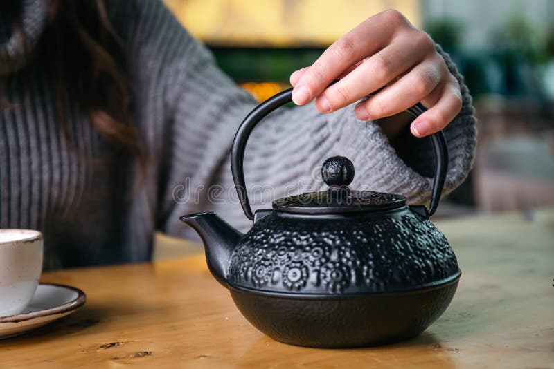 Cast Iron Black Turkish Teapot Closeup on the Table. Stock Photo