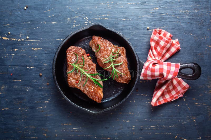 Castiron pan with meat stock image. Image of blood, protein 54621043