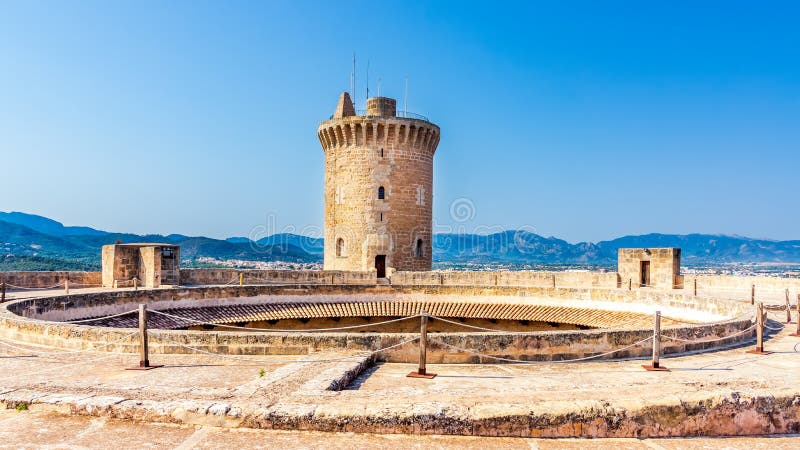 Castell de Bellver with mountains and blue sky in background, Palma de Mallorca, Spain