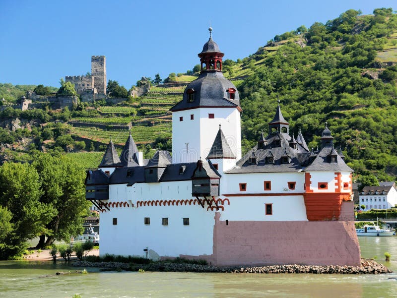 Sitting on the small Pfalz Island, this medieval (mid-14th century) installation was a toll house. It could house up to 20 soldiers and was well armed. Dangerous cataracts on the opposite bank forced ships to pass in the narrow chanel between the toll house and land near Kaub, Germany. Sitting on the small Pfalz Island, this medieval (mid-14th century) installation was a toll house. It could house up to 20 soldiers and was well armed. Dangerous cataracts on the opposite bank forced ships to pass in the narrow chanel between the toll house and land near Kaub, Germany.