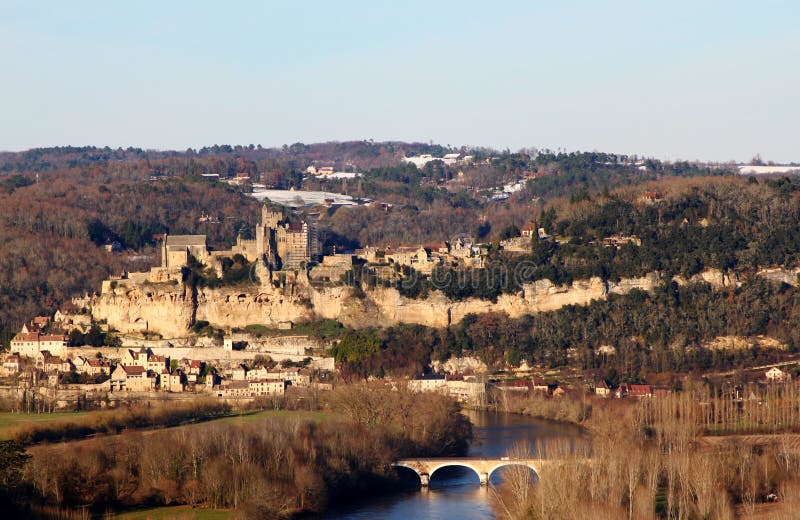 Dordogne River with the French Chateau de Beynac in the background located in Perigord, Aquitaine, France. Dordogne River with the French Chateau de Beynac in the background located in Perigord, Aquitaine, France.