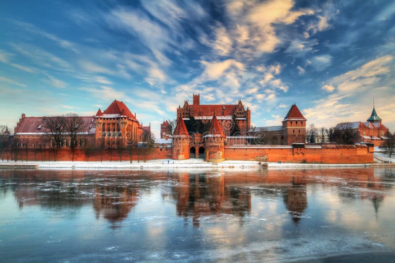 Teutonic castle in Malbork with reflection in frozen Nogat river, Poland. Teutonic castle in Malbork with reflection in frozen Nogat river, Poland