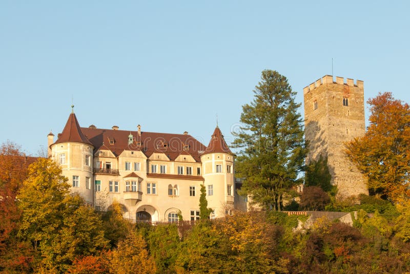 A Fairytale medieval castle on a hill in Bavaria during Fall. A Fairytale medieval castle on a hill in Bavaria during Fall