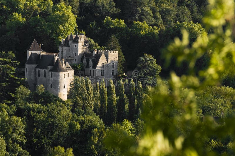 An old castle in front of Beynac, France at sunset. An old castle in front of Beynac, France at sunset