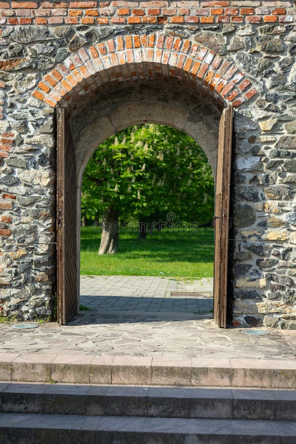 Castle wooden door leading to garden royalty free stock photos Castle wooden door leading to garden royalty free stock photos
