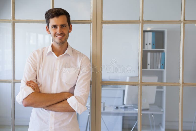 Casual businessman smiling at camera