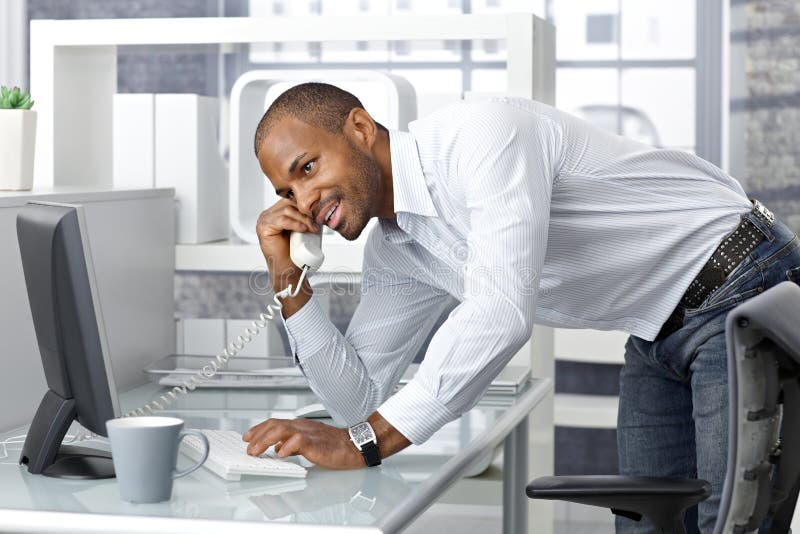 Casual businessman talking on phone stock images