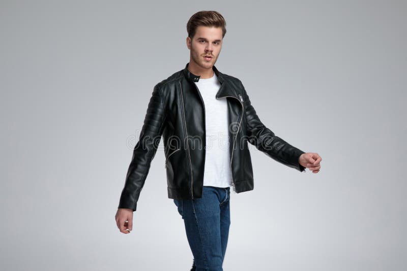 Casual Man With Black Leather Jacket Walking Relaxed Stock Photo ...