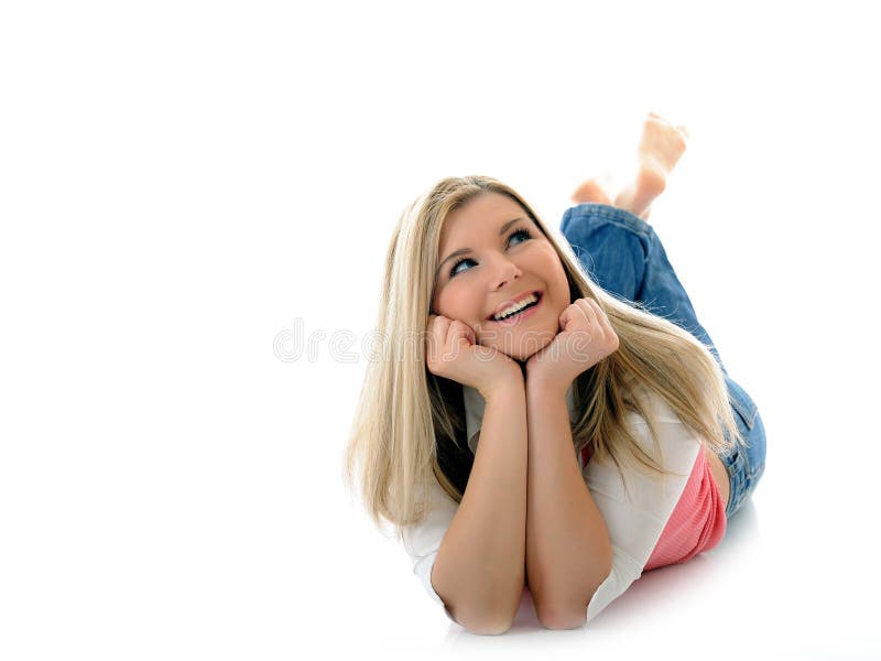 Casual smiling woman lying on the floor