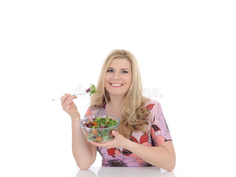 Casual woman eating healthy green vegetable salad