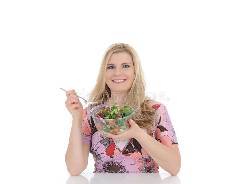 Casual woman eating healthy vegetable salad