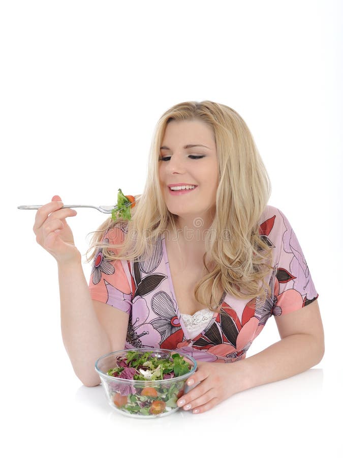 Casual woman eating healthy vegetable salad