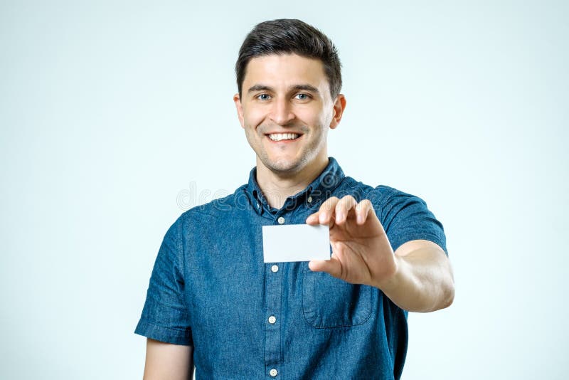 Casual young businessman holding business card royalty free stock photos Casual young businessman holding business card royalty free stock photos