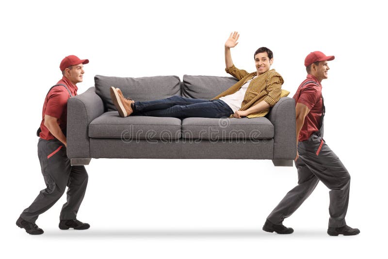 Casual Young Man Lying On A Sofa Carried By Two Movers Stock Image