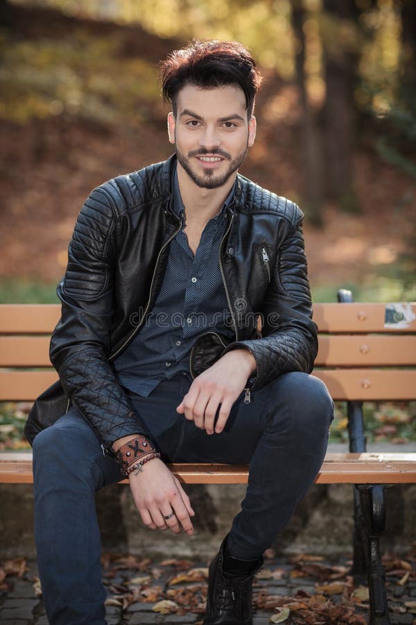 Casual Young Man Sitting, Resting His Hands on His Kness Stock Image ...