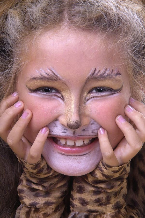 Cat girl. Smiling girl with cat make-up royalty free stock photo Cat girl. Smiling girl with cat make-up royalty free stock photo