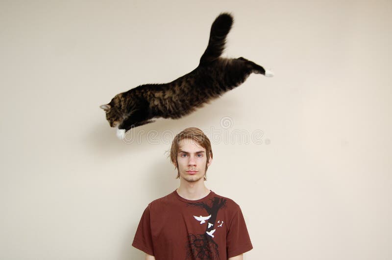 Cat Jumping Over A Man's Head