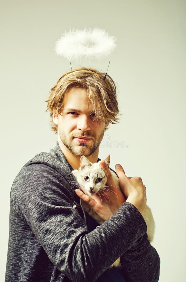 Cat and Man with Angel Halo on Head Holding Cat Stock Photo - Image of friendship, kitty: 148458108 Cat and Man with Angel Halo on Head Holding Cat Stock Photo - Image of friendship, kitty: 148458108