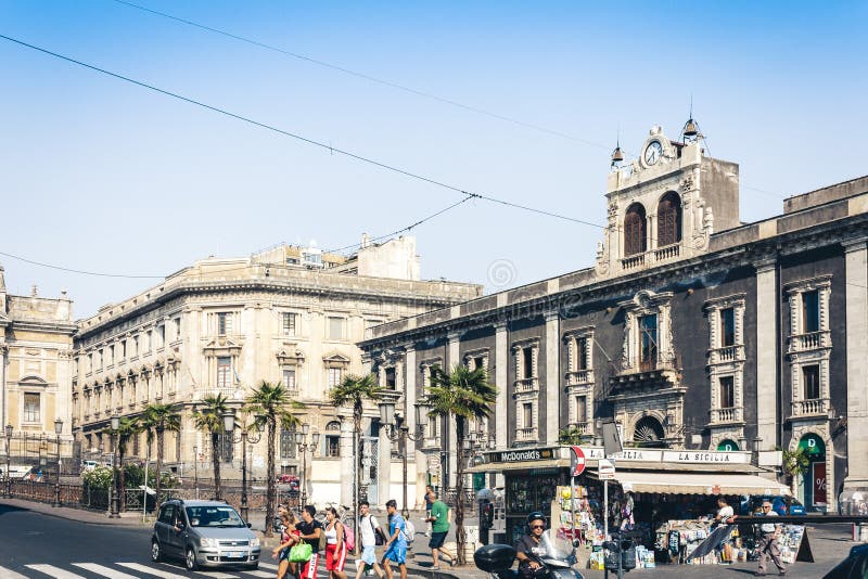 Catania, Sicily, Italy – august 14, 2018: traditional architecture, historical street with old buildings with newsstand stock photo Catania, Sicily, Italy – august 14, 2018: traditional architecture, historical street with old buildings with newsstand stock photo